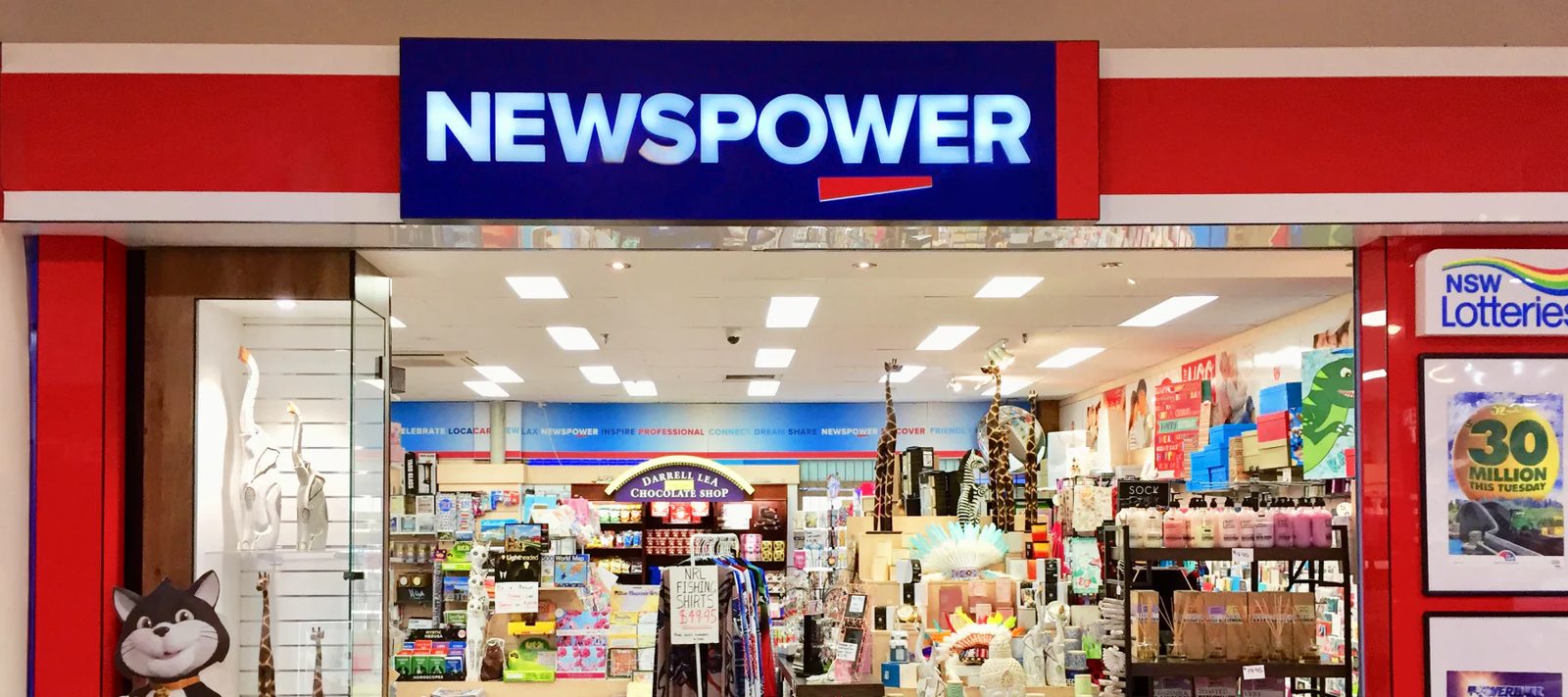 Newsagency storefront with confectionery, giftware, toys and retail products on display