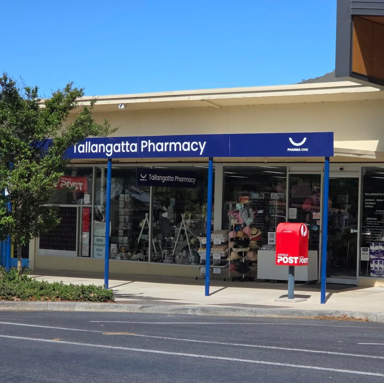 Community pharmacy storefront with front-of-shop retail and Australia Post services